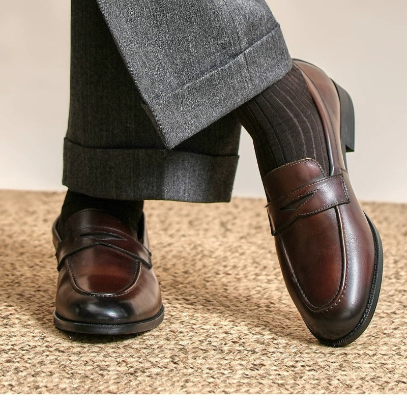 Lunepebbla two waxed calfskin penny loafers in black and brown with hand-burnished finish