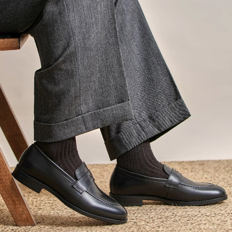 Lunepebbla waxed calfskin penny loafers close-up showing apron stitching and penny strap