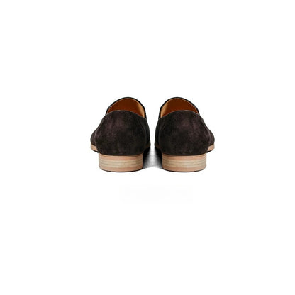 Lunepebbla olive suede horsebit loafers worn with tailored chinos showing gold buckle on foot