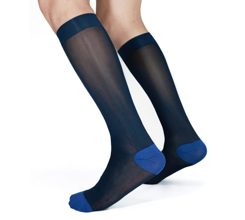 Lunepebbla sheer navy nylon dress socks with contrast blue sole and toe, knee-high on foot