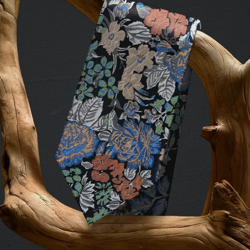 Lunepebbla garden floral silk necktie draped showing rich color and botanical detail