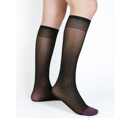 Lunepebbla ribbed sheer black nylon dress socks with contrast purple toe, knee-high on foot