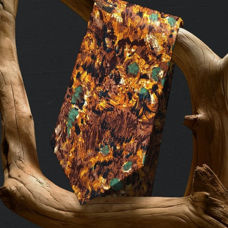 Renaissance floral silk necktie draped on natural wood showing oil painting texture and amber gold teal jacquard pattern