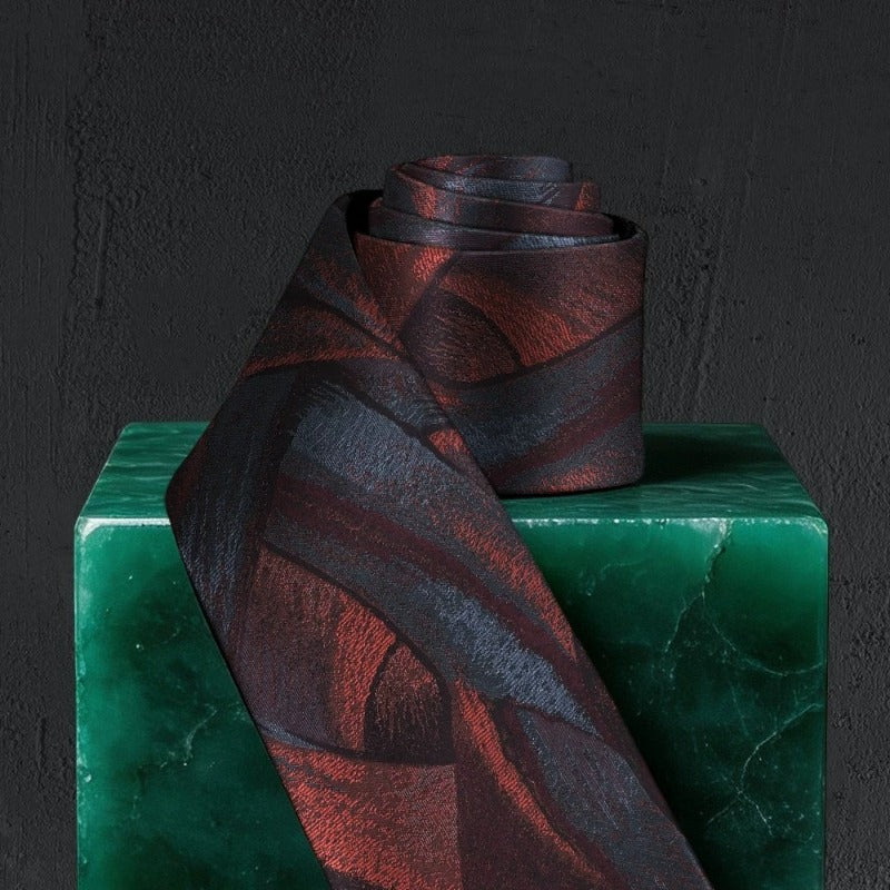 Lunepebbla abstract ribbon silk necktie rolled showing fabric weight and silk quality