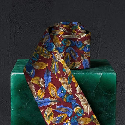Lunepebbla feather pattern silk necktie rolled showing fabric weight and silk quality