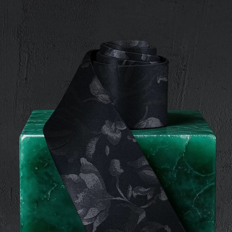 Lunepebbla tonal floral silk necktie rolled showing fabric weight and mulberry silk quality