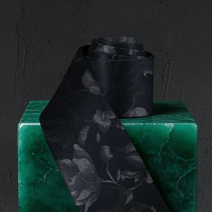 Lunepebbla tonal floral silk necktie rolled showing fabric weight and mulberry silk quality