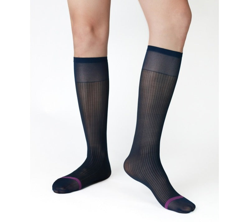 Lunepebbla ribbed sheer navy nylon dress socks with contrast purple toe, knee-high on foot