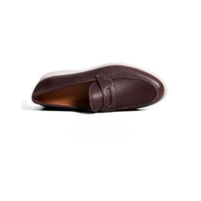 Lunepebbla pebble-grain penny loafers sole view showing white rubber outsole anti-slip tread