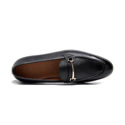 Lunepebbla black leather horsebit loafers close-up of gold-tone horsebit hardware detail