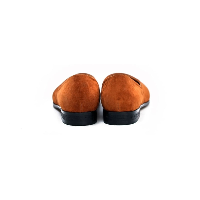 Lunepebbla black leather pointed-toe loafers worn with tailored trousers on foot