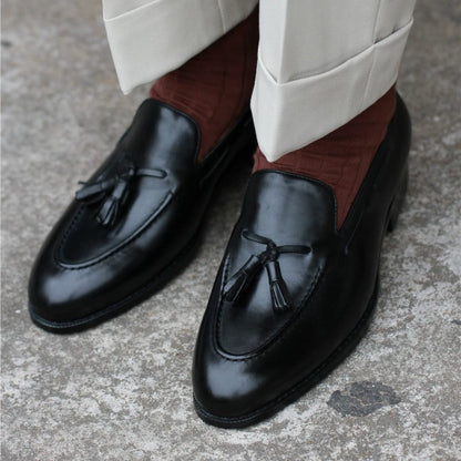Lunepebbla handmade black full-grain leather tassel loafers with twin tassels and caramel lining