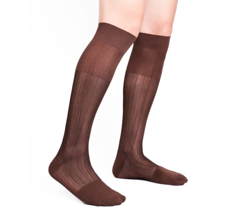 Lunepebbla ribbed sheer dress socks worn with leather loafers showing rib texture on foot
